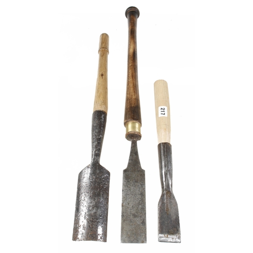 217 - An early socket chisel by ISAAC GREAVES, another chisel and a large pitted early gouge G