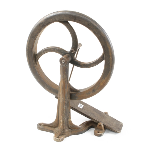 324 - An iron treadle wheel on fluted stand 16