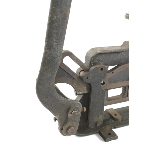 576 - A heavy cast iron guillotine with 12