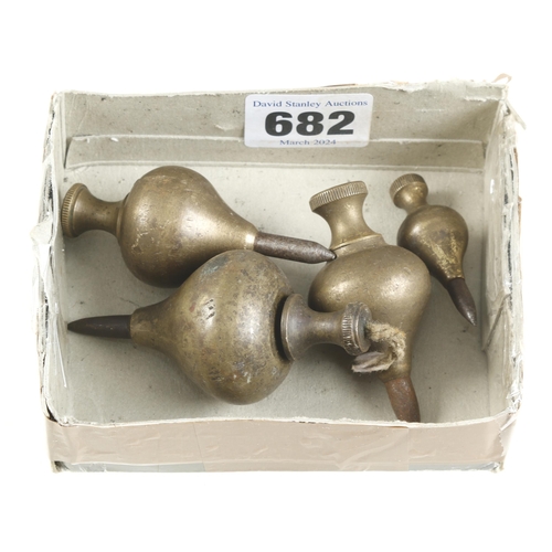 682 - Four steel tipped brass plumb bobs 1 3/4