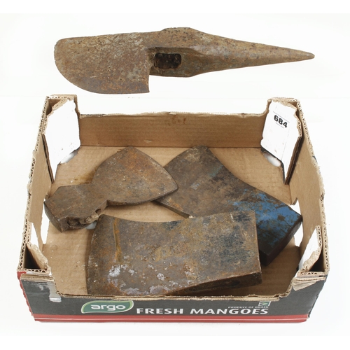 684 - An unusual heavy axe type tool and 3 axe heads G