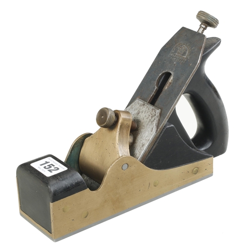 152 - A craftsman made steel soled adjustable brass smoother with ebony infills and handle G+