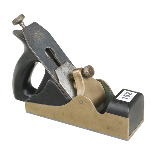 152 - A craftsman made steel soled adjustable brass smoother with ebony infills and handle G+