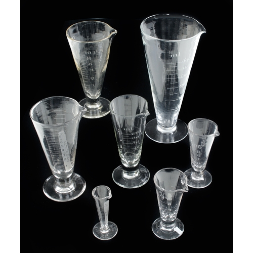 621 - A collection of 7 conical glass Imperial and Metric  measures 120ml to 500ml, tiny chip to one o/w F