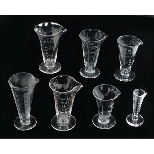 622 - A collection of 7 Imperial conical glass measures 120ml to 3 fl. ozs G++