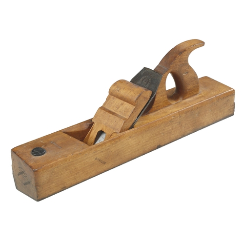 750 - An unusual handled beech badger plane by CLEGG set at an angle with iron sole and side and scrolled ... 