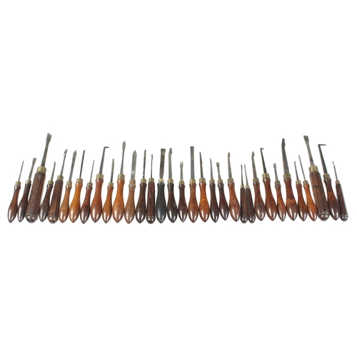 913 - 58 rosewood handled ornamental turning tools, 31 named HOLTZAPPFEL the rest matching and probably mo... 