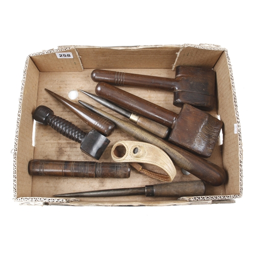 258 - A collection of sailmakers tools inc. an ebony seam rubber with initials, 2 serving mallets and 2 fi... 