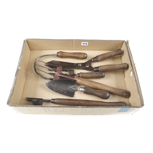 315 - Six vintage garden tools G