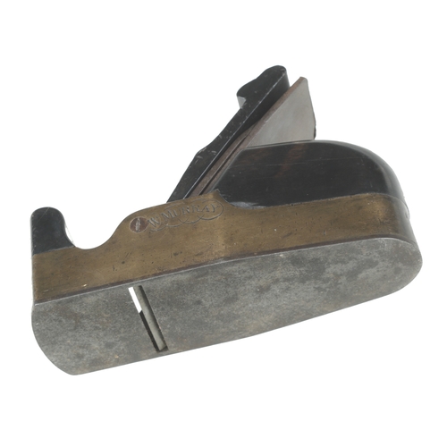 910 - A nice quality steel soled gunmetal smoother with ebony infill and wedge, chip to wedge and some dis... 