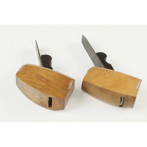 107 - A pair of craftsman made beech compass planes with flat and round soles and ebony wedges G++