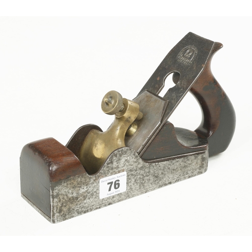 76 - A d/t steel parallel smoother with brass lever, light pitting o/a G