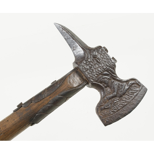 1238 - An important decorative 18c German strapped hand axe, the head in the form of an eagle, the 3 1/2