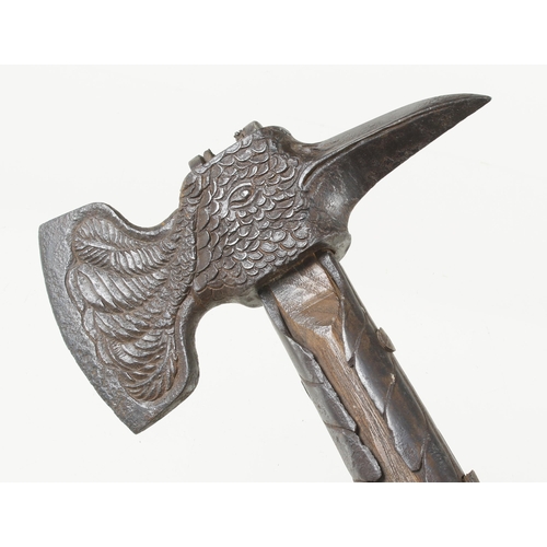 1238 - An important decorative 18c German strapped hand axe, the head in the form of an eagle, the 3 1/2