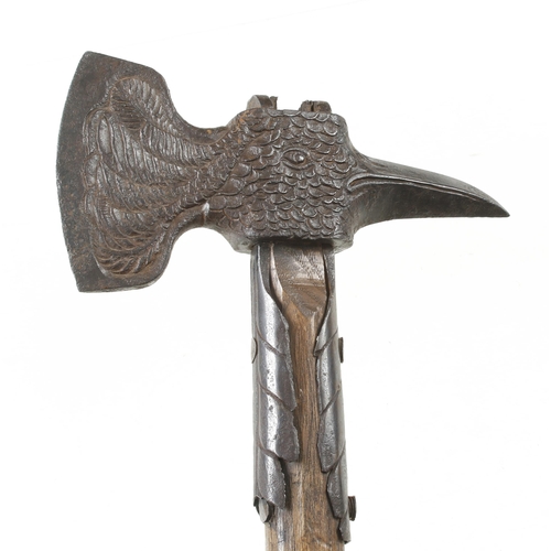 1238 - An important decorative 18c German strapped hand axe, the head in the form of an eagle, the 3 1/2