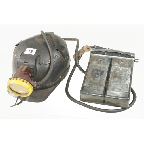 18 - A miner's safety helmet with battery pack G