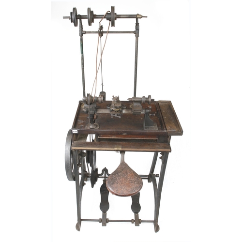 626 - A jeweller's/engineer's two footed treadle lathe with overhead gear and integral seat with numerous ... 