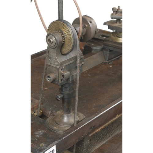 626 - A jeweller's/engineer's two footed treadle lathe with overhead gear and integral seat with numerous ... 