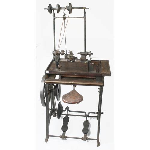 626 - A jeweller's/engineer's two footed treadle lathe with overhead gear and integral seat with numerous ... 