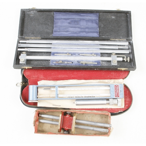 163 - A pocket whirling hygrometer, a set of trammels and a marking gauge all in orig boxes G to G+