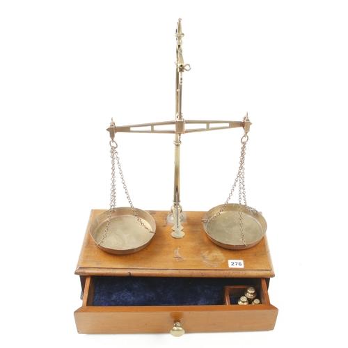 276 - A brass bullion scale by DAY & MILLWARD on mahogany base with drawer c/w set of Troy weights for 191... 