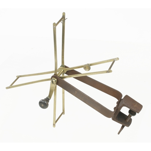 741 - An iron and brass wool winder G