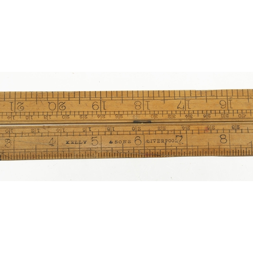 883 - A 2' two fold boxwood and brass slide rule by PRESTON also stamped Kelly & Sons Liverpool G+