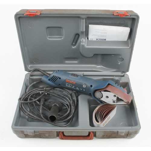 114 - An engraving tool, a combination tool with attachments and a BOSCH compact belt sander G Not For Exp... 