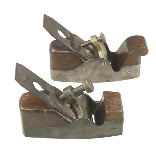 88 - Two iron smoothers with brass levers G+