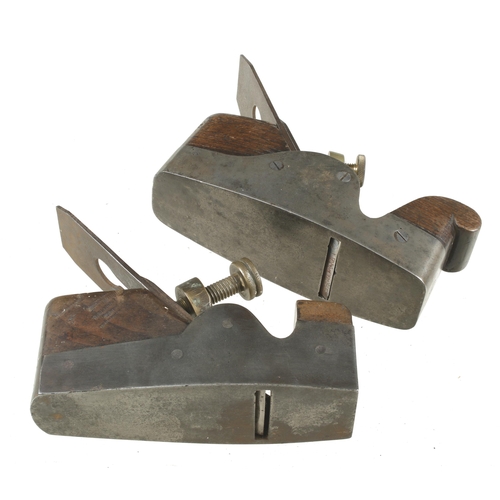 88 - Two iron smoothers with brass levers G+