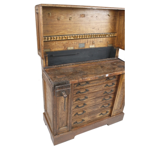 A MELHUISH work bench and tool chest 40" x 40" x 17" c/w 6 drawers, two side cabinets, orig vice and orig trade label to lid, lid hinges require attention o/w G+ Not for mailing