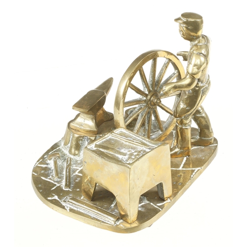 48 - A brass model of a wheelwright at work G+