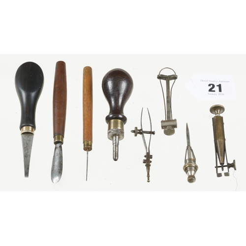21 - Eight small watchmaker's tools in suede roll G+