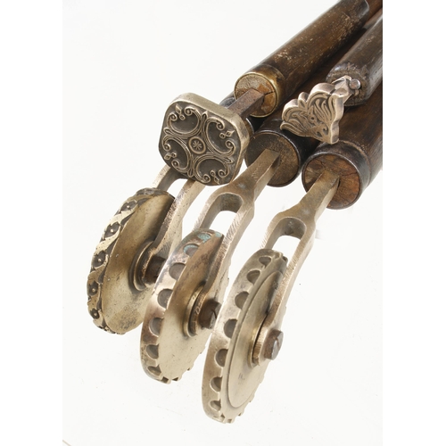 57 - Three bookbinder's brass border rolls and two embossing stamps G+