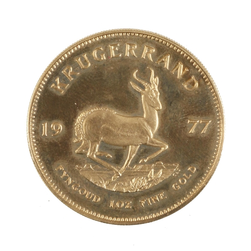11 - A 1977 gold Krugerrand 33.93 grams total weight in orig case