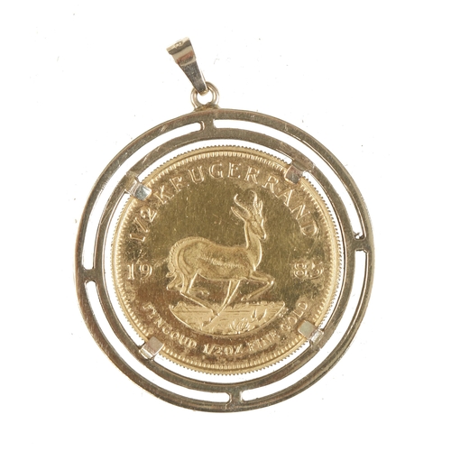 15 - A half oz gold Krugerrand in 9ct gold frame 23.08 grams total weight