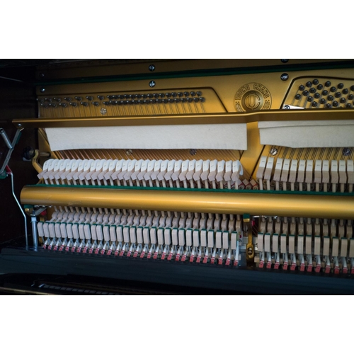 19 - Young Chang (c1987)  A Model U-121 upright piano in a bright ebonised case; together with a duet sto... 