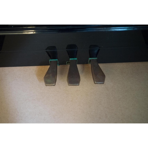 19 - Young Chang (c1987)  A Model U-121 upright piano in a bright ebonised case; together with a duet sto... 