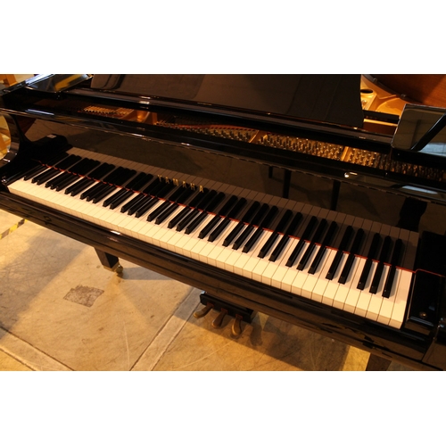 4 - Yamaha (c2009)  A 5ft 6in Model GC2 grand piano in a bright ebonised case on square tapered legs; to... 