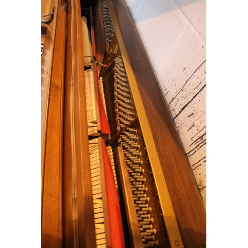 7 - Hoffmann (c1985)  A Model Barock/Chippendale upright piano in a mahogany case with cabriole supports... 