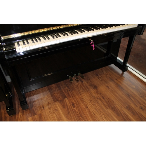 19 - Young Chang (c1987)  A Model U-121 upright piano in a bright ebonised case; together with a duet sto... 