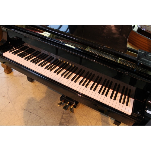 24 - Yamaha (c1984) A 7ft 6in Model C7 grand piano in a bright ebonised case on square tapered legs. AMEN... 