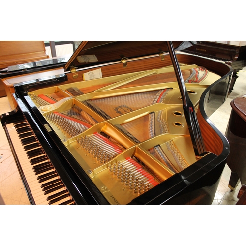 24 - Yamaha (c1984) A 7ft 6in Model C7 grand piano in a bright ebonised case on square tapered legs. AMEN... 