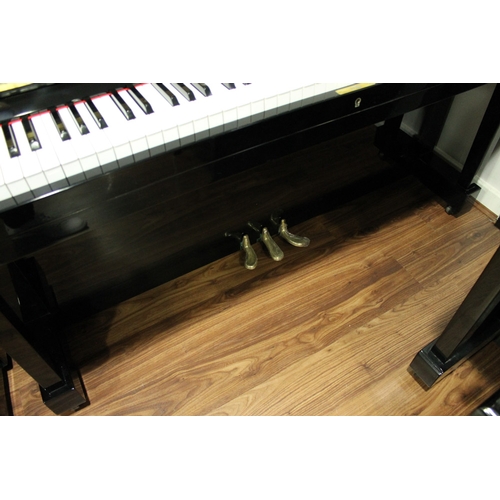 11 - Miki  A 121cm Model MU1D upright piano in a bright ebonised case.