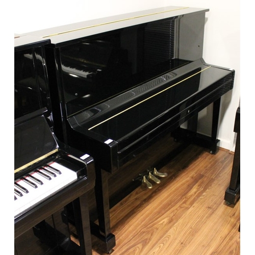 11 - Miki  A 121cm Model MU1D upright piano in a bright ebonised case.
