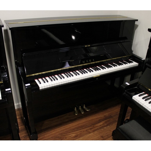 11 - Miki  A 121cm Model MU1D upright piano in a bright ebonised case.