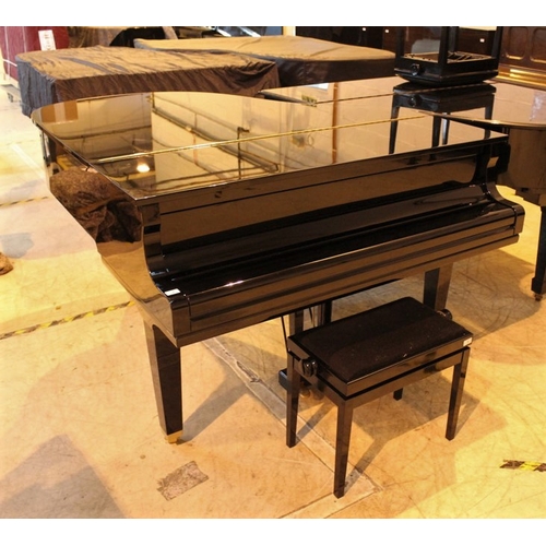 4 - Yamaha (c2009)  A 5ft 6in Model GC2 grand piano in a bright ebonised case on square tapered legs; to... 