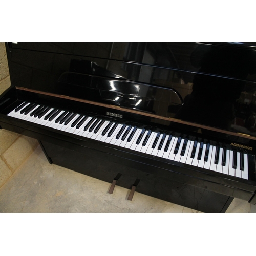 12 - Kemble (c1971)A Nordia upright piano in a bright ebonised case; together with a matching stool.... 