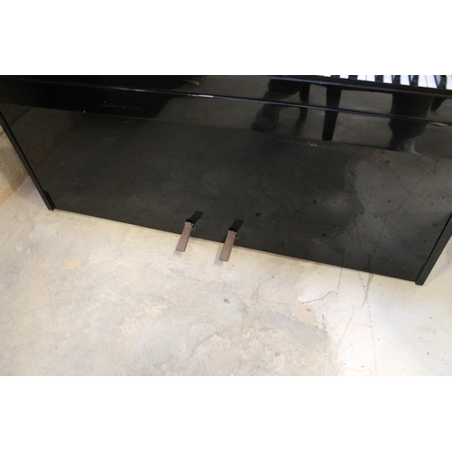 12 - Kemble (c1971)A Nordia upright piano in a bright ebonised case; together with a matching stool.... 