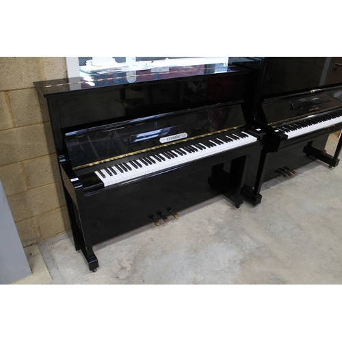 23 - ElysianA recent upright piano in a traditional ebonised case.